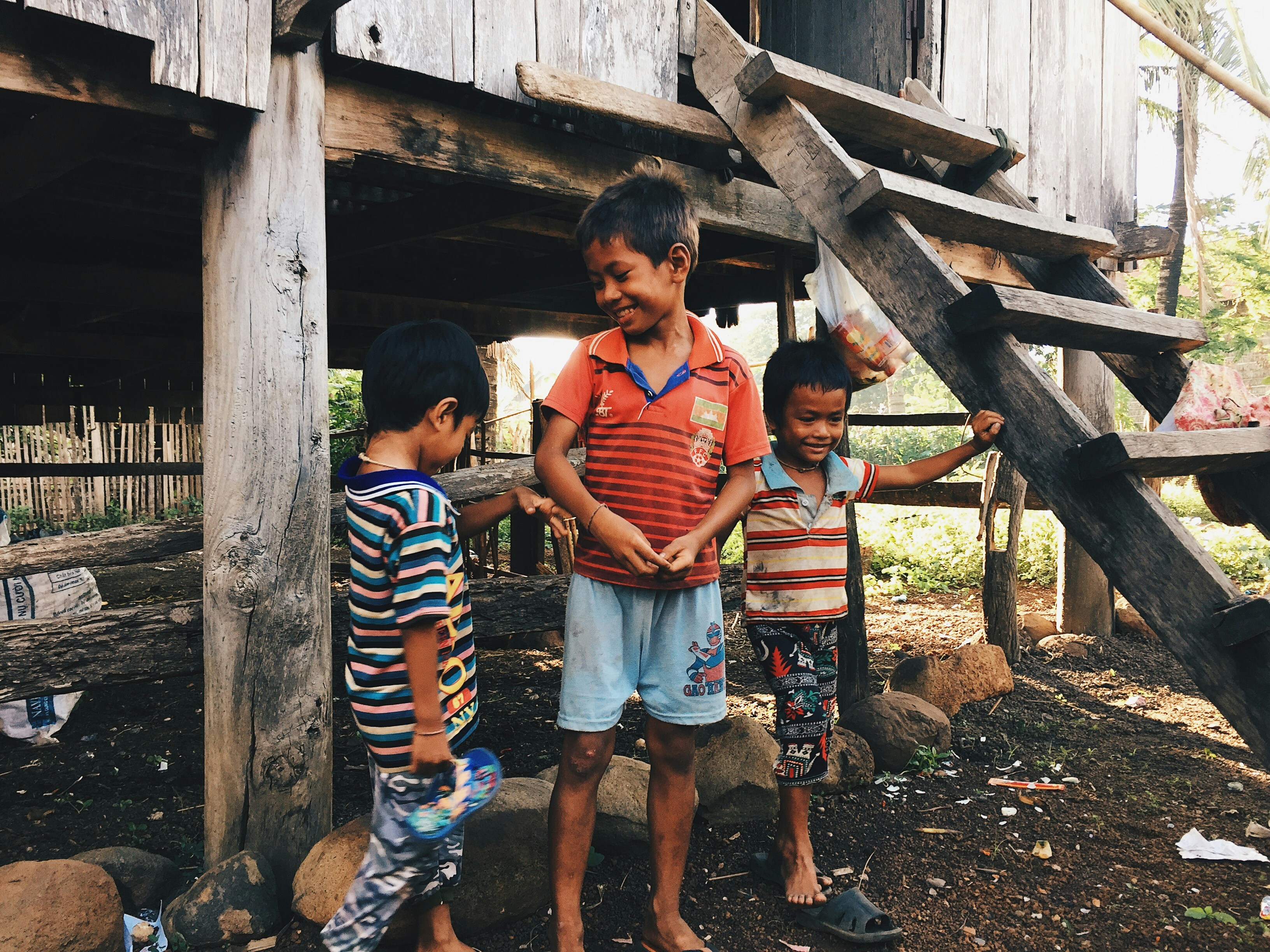 Three boys playing together outdoors
