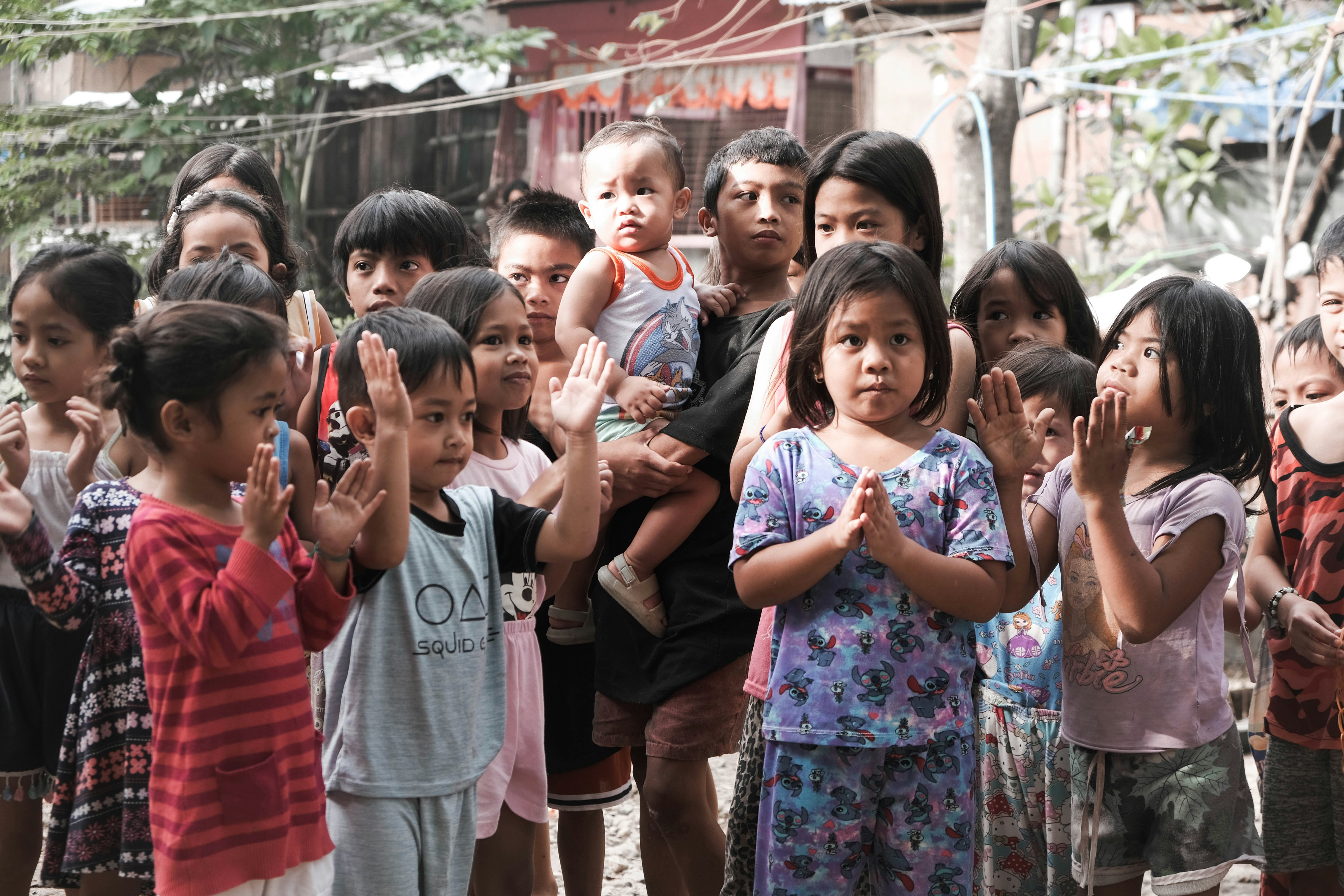 Children waving and smiling