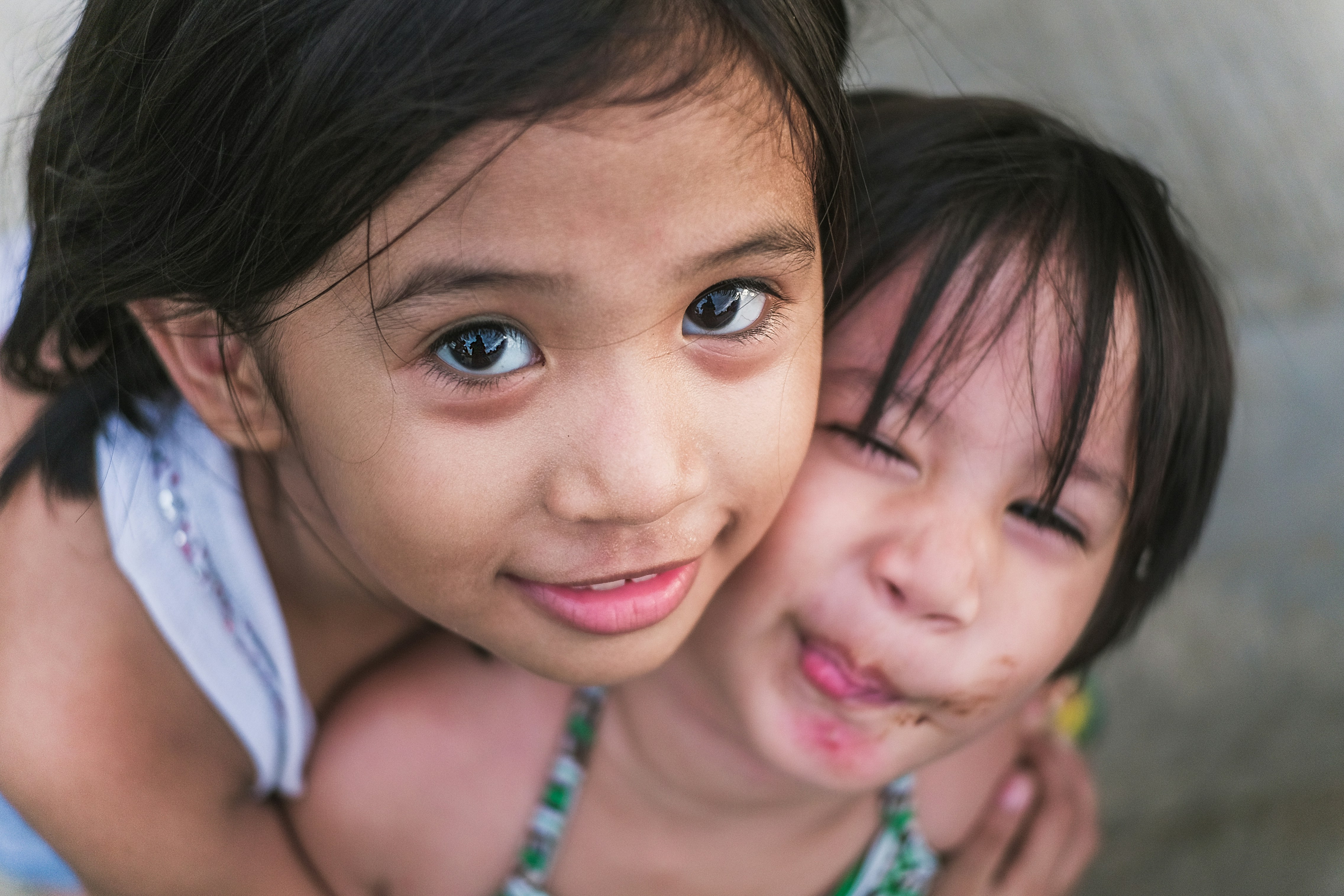 Two sisters embracing lovingly